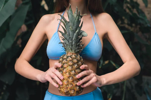 Partial View Girl Blue Bikini Holding Pineapple — Free Stock Photo