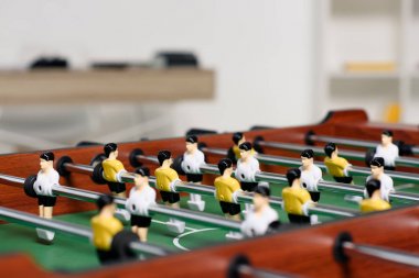 table football in living room at home clipart