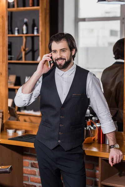 Handsome Young Barber Talking Phone Workplace — Free Stock Photo