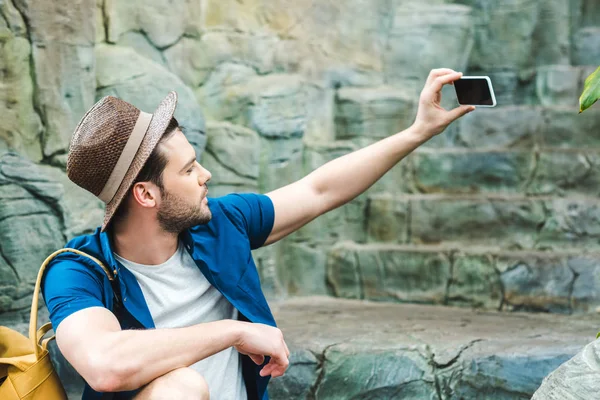 Attractive Young Man Taking Selfie While Sitting Stone Staircase — Free Stock Photo