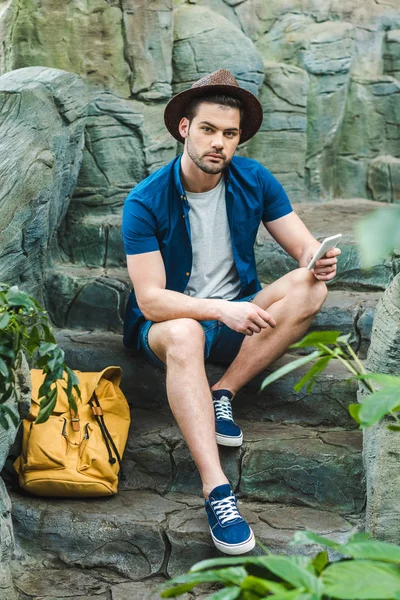 Attractive Young Man Using Smartphone While Sitting Stone Staircase — Stock Photo, Image