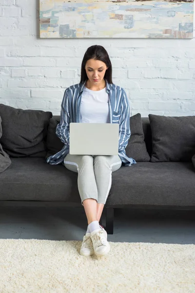 Young Woman Using Laptop Sofa Home — Free Stock Photo