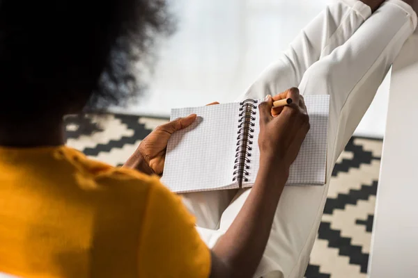 Partial View African American Freelancer Making Notes Notebook Home Office — Free Stock Photo