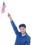 快乐十几岁的学生女孩与美国国旗在举起手在白色隔离