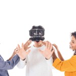 Teenage students having fun with vr headset isolated on white