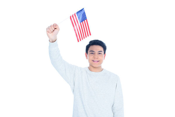 happy teen asian student boy with usa flag isolated on white