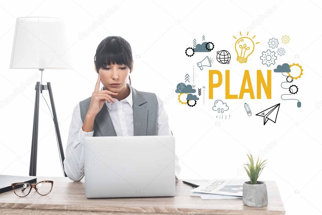 businesswoman sitting at table and looking at laptop isolated on white, plan inscription and business icons