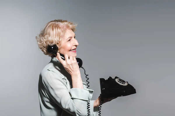 Side View Smiling Senior Woman Talking Vintage Phone Isolated Grey — Stock Photo, Image