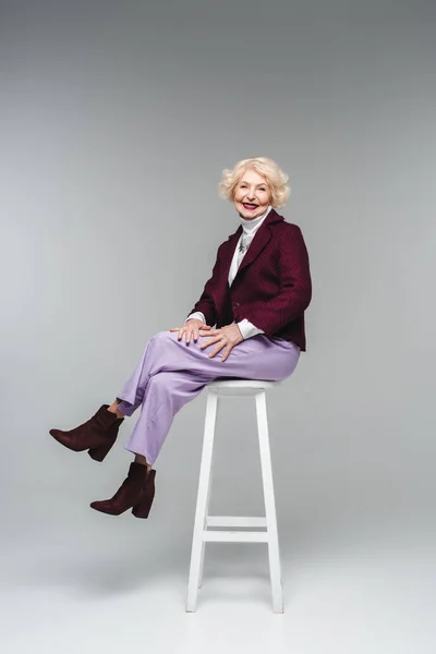 Attractive Senior Woman Stylish Clothes Sitting Chair Grey — Stock Photo, Image