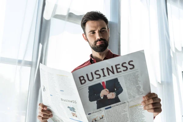 Bottom View Handsome Young Businessman Reading Newspaper — Stock Photo, Image