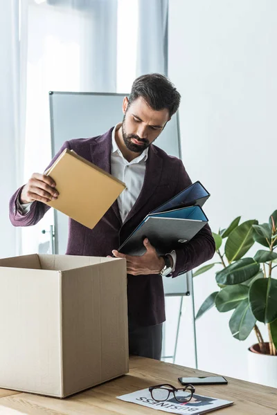 Dismissed Young Businessman Putting Books Folders Box — Stock Photo, Image