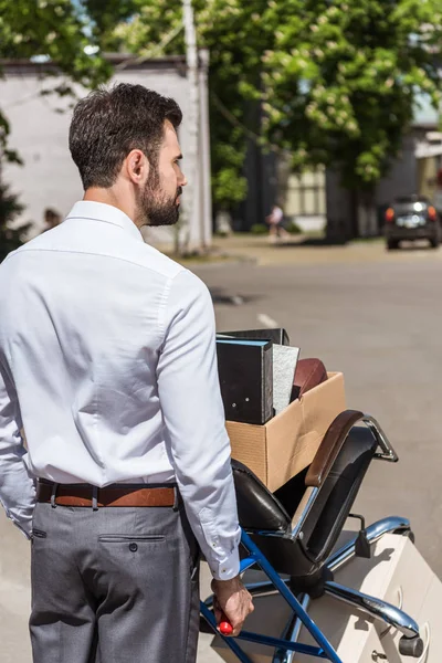 Rear View Fired Young Manager Boxes Trolley Cart — Free Stock Photo