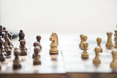 close-up view of wooden chess figures on chess board, selective focus clipart