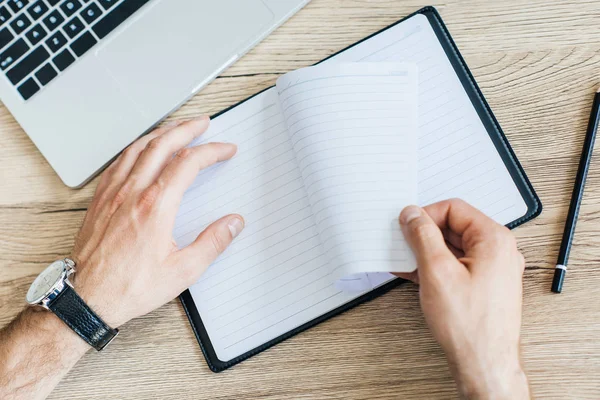 Partial Top View Person Holding Blank Notebook Workplace — Stock Photo, Image