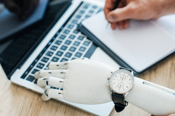 Selective Focus Robotic Arm Wristwatch Using Laptop Human Hand Taking Stock Picture