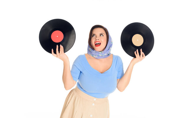 happy stylish pin up woman holding vinyl records isolated on white