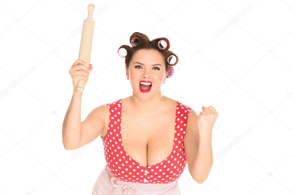 engry plus size housewife with wooden rolling pin shouting at camera isolated on white