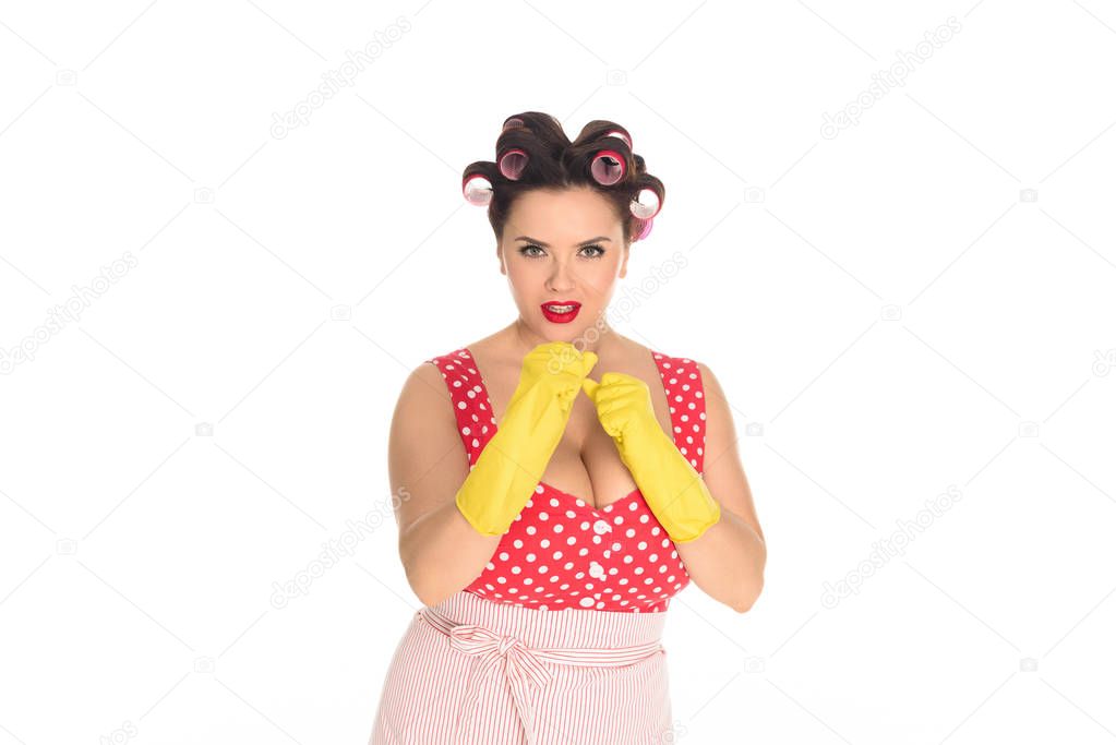 angry plus size housewife in rubber gloves standing in fight pose isolated on white
