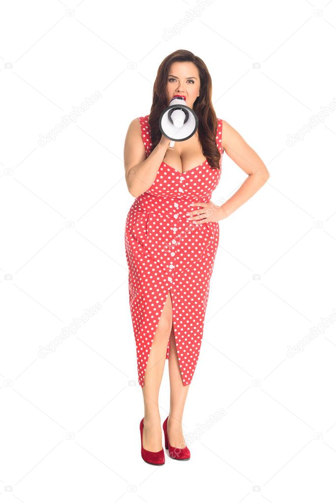 angry plus size woman shouting at loudspeaker and looking at camera isolated on white