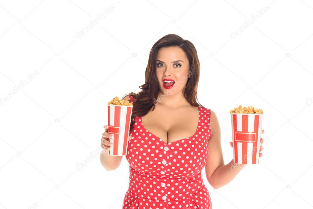 excited plus size woman with boxes of popcorn isolated on white