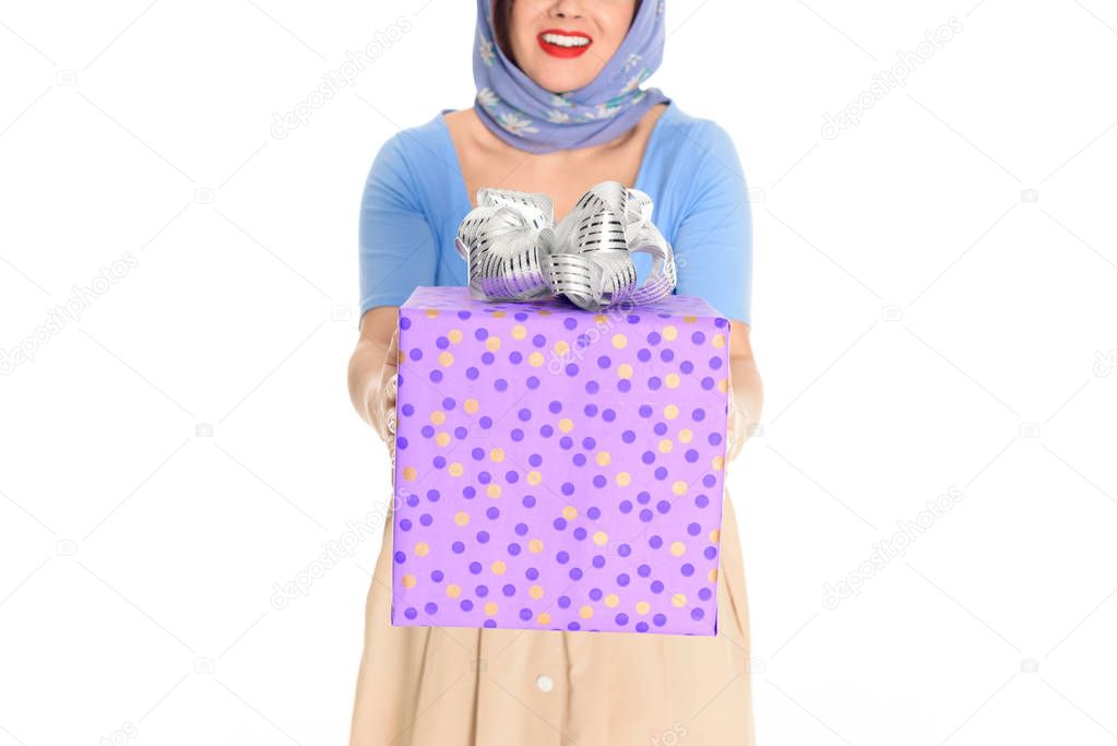 cropped shot of smiling vintage woman holding gift box isolated on white