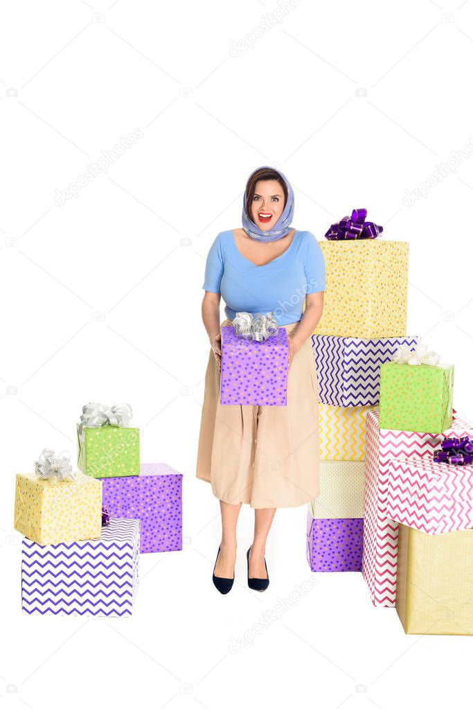 beautiful stylish young woman holding present and smiling at camera isolated on white 