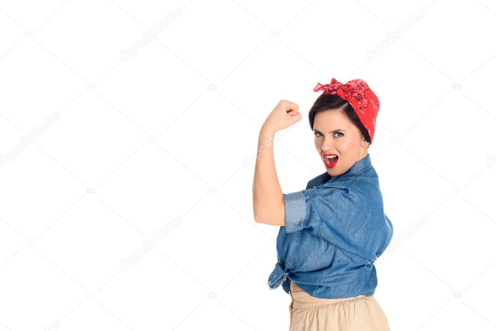 excited pin up woman showing biceps and looking at camera isolated on white 