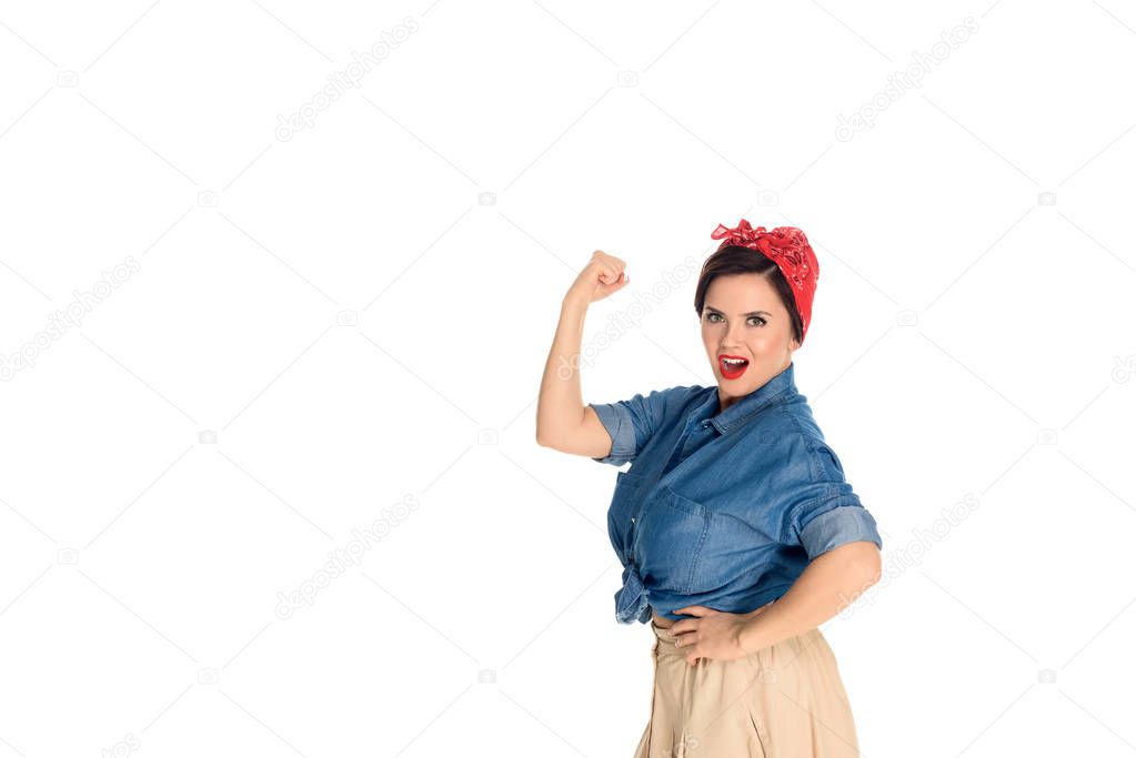 confident pin up woman showing biceps and looking at camera isolated on white 