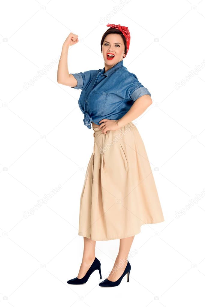full length view of emotional pin up woman showing muscles and looking at camera isolated on white 