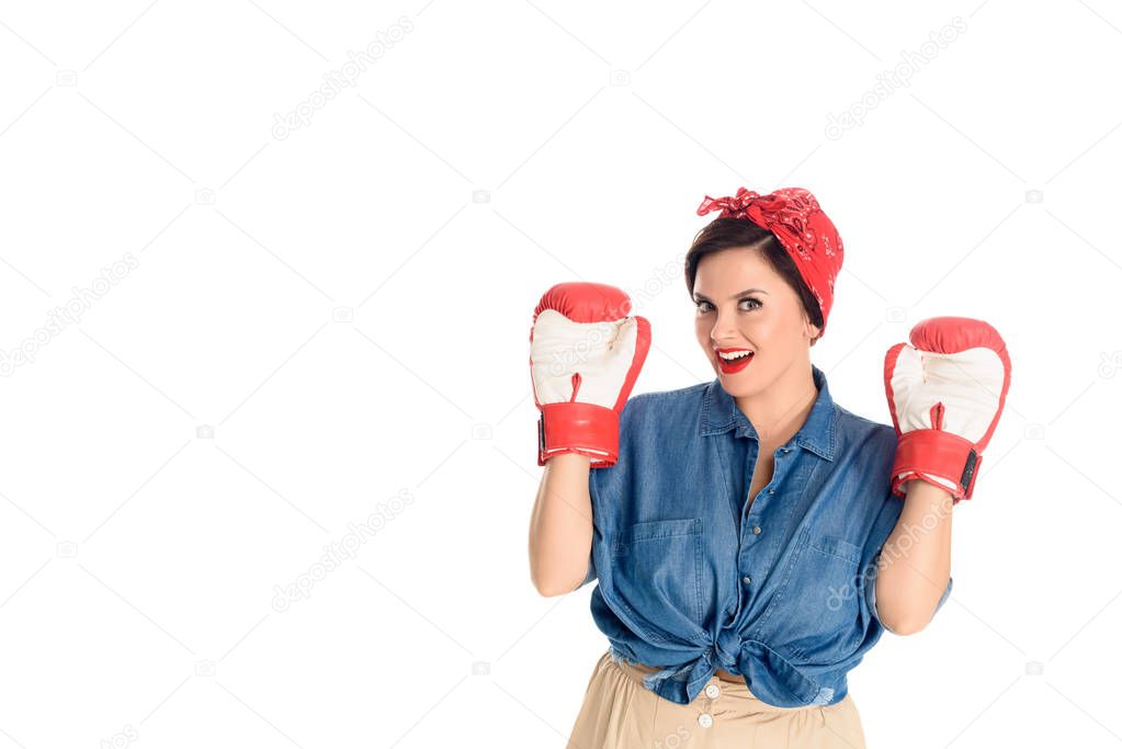 beautiful pin up woman in boxing gloves smiling at camera isolated on white