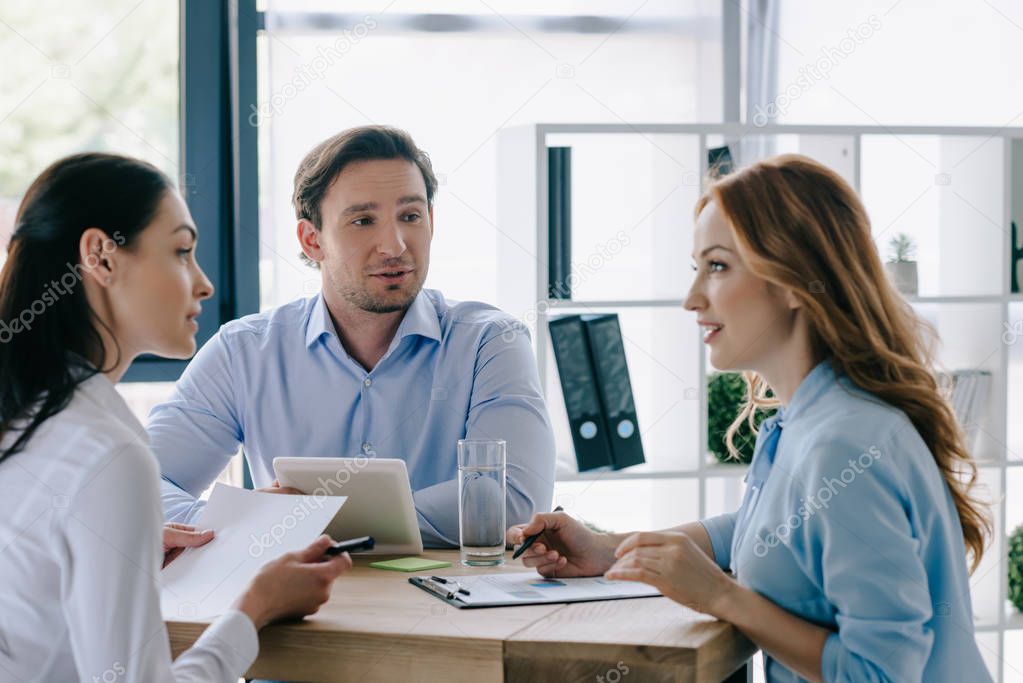 business people discussing business project at workplace in office