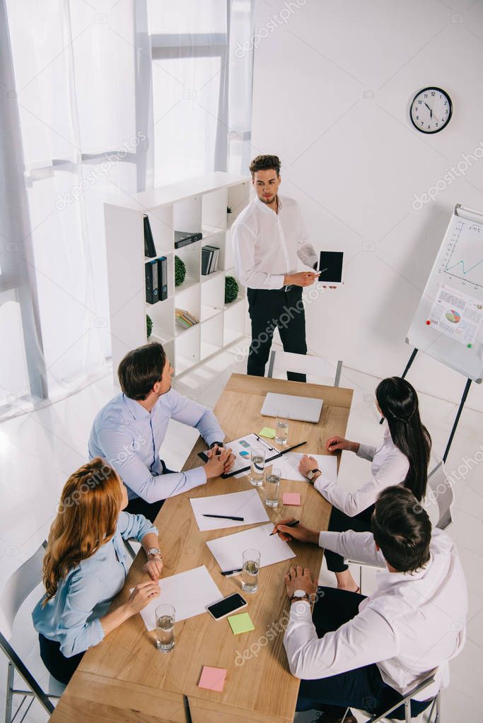 high angle view of business coworkers having business training in office