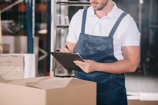 Cropped View Warehouse Worker Writing Clipboard While Standing Cardboard Box — Stock Photo, Image