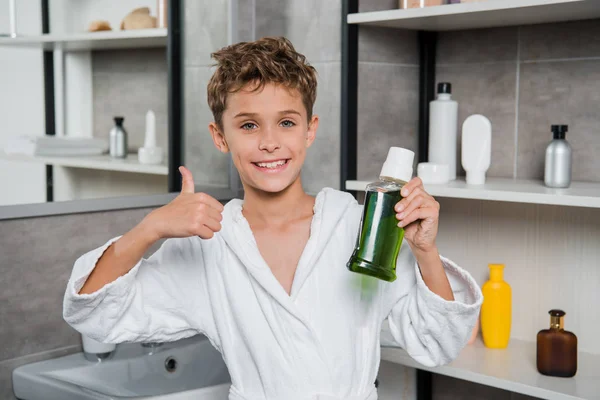 Happy Boy Holding Bottle Green Mouthwash Showing Thumb Bathroom — Stock Photo, Image