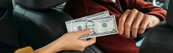 Cropped View Woman Giving Dollar Banknotes Taxi Driver Panoramic Shot — Stock Photo, Image