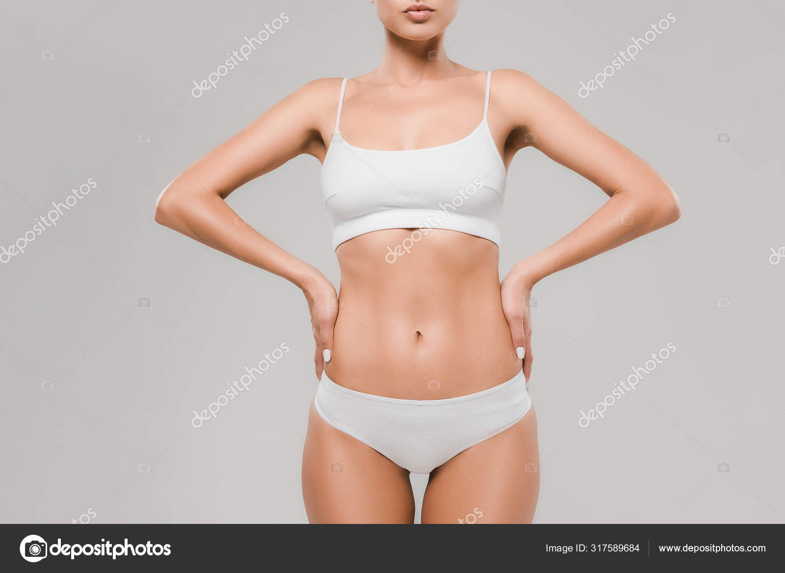 Cropped View Beautiful Slim Woman Underwear Posing Hands Hips Isolated  Stock Photo by ©IgorVetushko 317589684