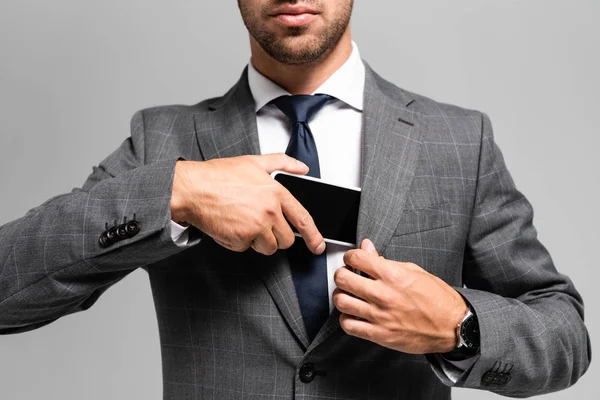 Oříznutý Pohled Podnikatele Obleku Skrývající Smartphone Izolované Šedé — Stock fotografie