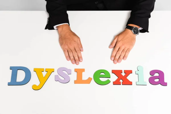 Cropped View Businessman Suit Sitting Dyslexia Lettering — ストック写真