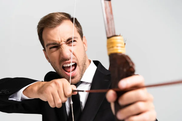Selective Focus Angry Businessman Suit Holding Bow Shooting Arrow Isolated — Stock Photo, Image