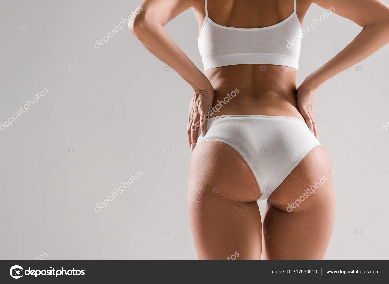 Back View Beautiful Slim Woman Underwear Hands Hips Isolated Grey Stock  Photo by ©IgorVetushko 317590600