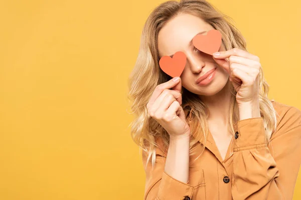 Smiling Woman Covering Eyes Paper Heart Signs Isolated Yellow — ストック写真