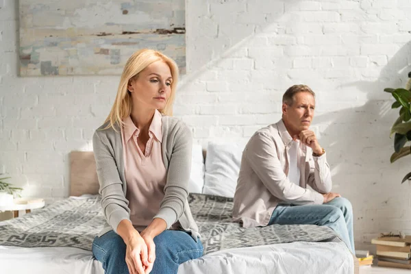 Worried Couple Sitting Bed Looking Away — Stock Photo, Image