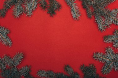 top view of christmas frame with spruce branches on red clipart