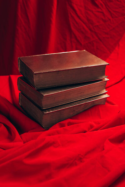 close up of vintage golden books on red cloth