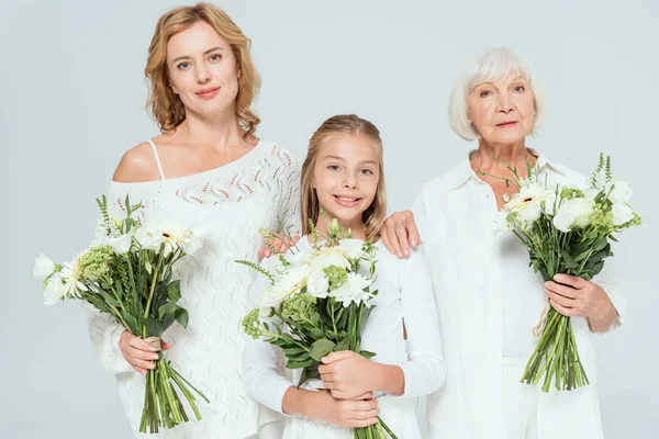 Smiling Granddaughter Mother Grandmother Holding Bouquets Isolated Grey — Stock Photo, Image