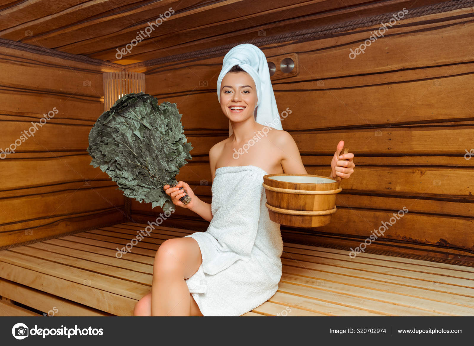 https://st3.depositphotos.com/12982378/32070/i/1600/depositphotos_320702974-stock-photo-smiling-woman-towels-holding-birch.jpg