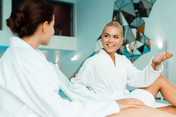 Attractive Smiling Friends White Bathrobes Talking Spa — Stock Photo, Image