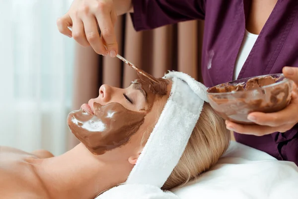 Cropped View Cosmetologist Applying Face Mask Attractive Woman Spa Stock Picture