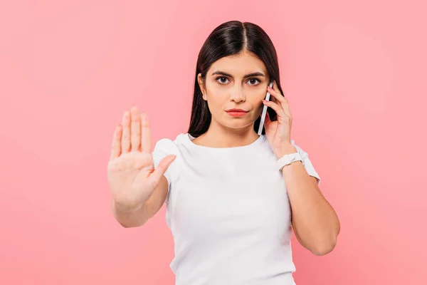 Pretty Brunette Girl Talking Smartphone Showing Stop Gesture Isolated Pink — Stock Photo, Image