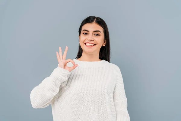 Happy Pretty Brunette Girl White Sweater Showing Isolated Grey — Stock Photo, Image